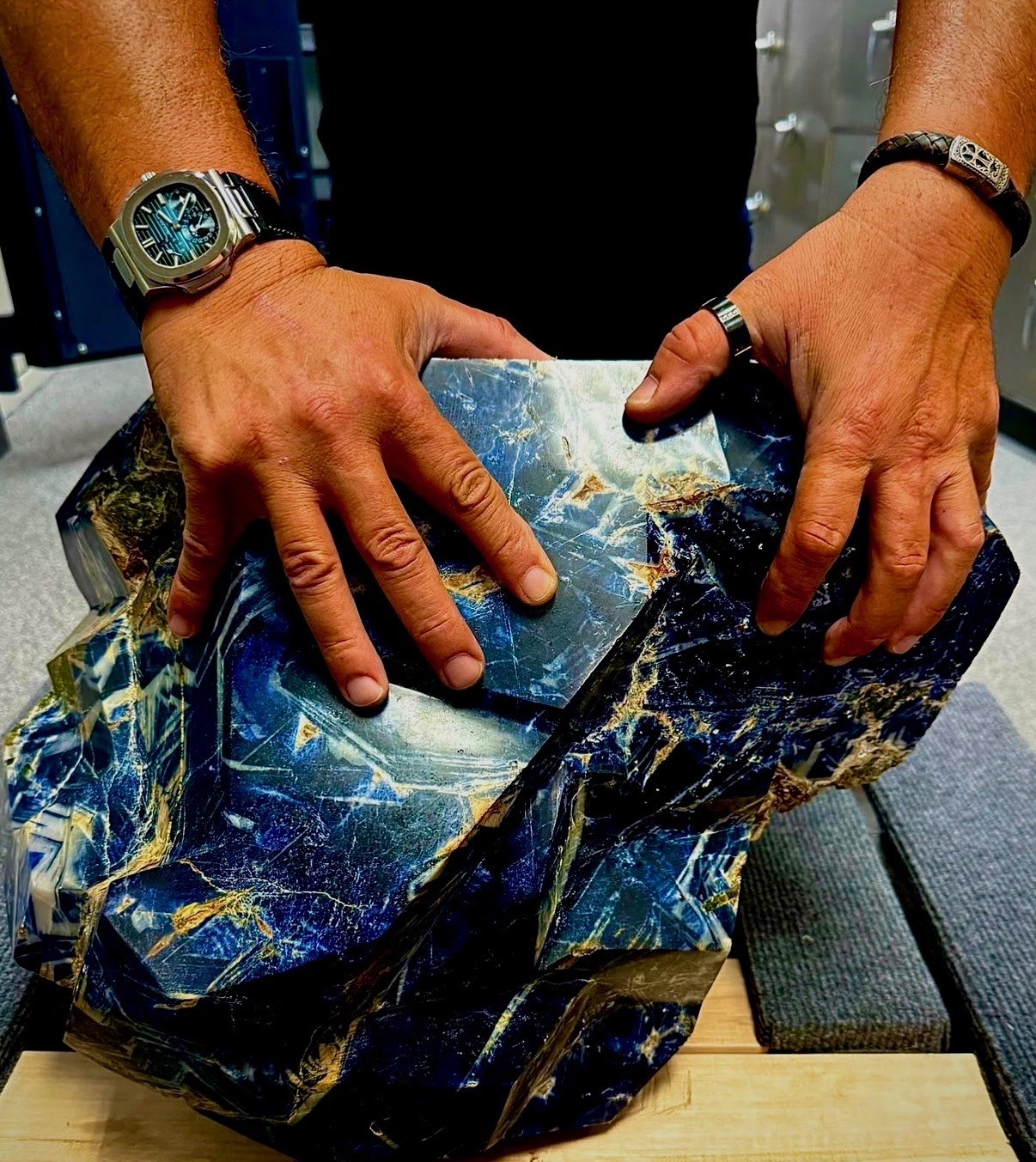 Hands demonstrating the scale of The Mother sapphire